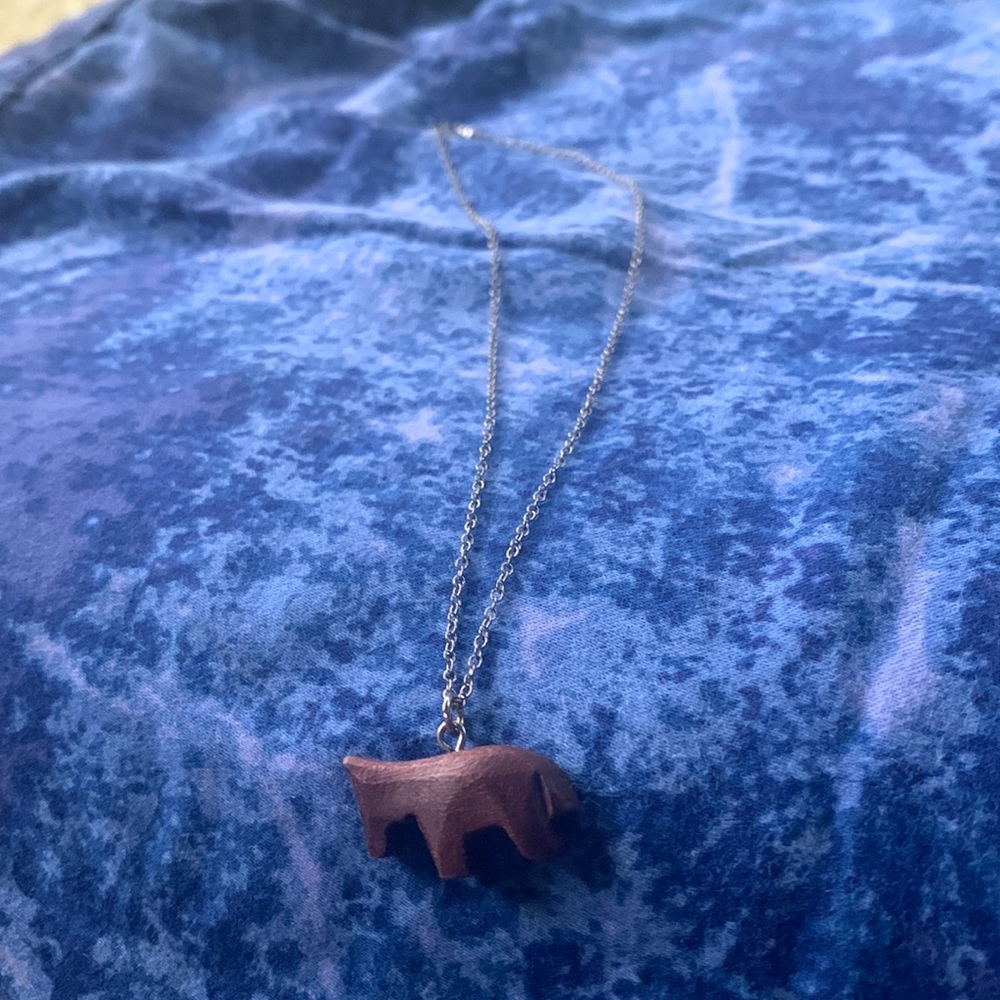 simple wooden mule or horse on a silver chain